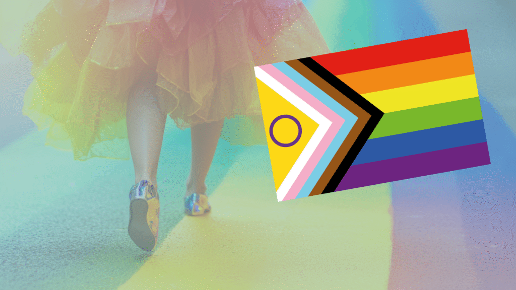 A person in a colorful skirt walks on a rainbow path. An Intersex-Inclusive Progress Pride flag graphic is shown.